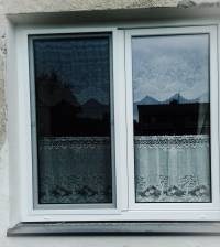 Výměna oken na městských domech č. p. 25 a 14, v ulici Krasov